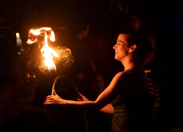 A warm profile across from the flame