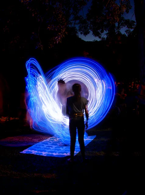 Blue light wings around a silhouette