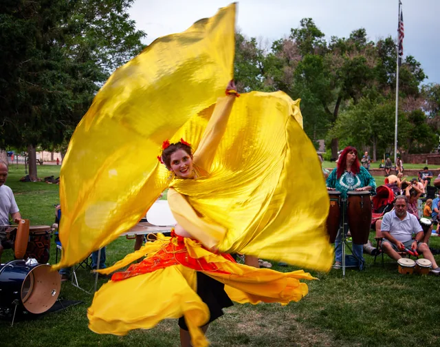 Dancer wrapped in sweeping yellow fabric