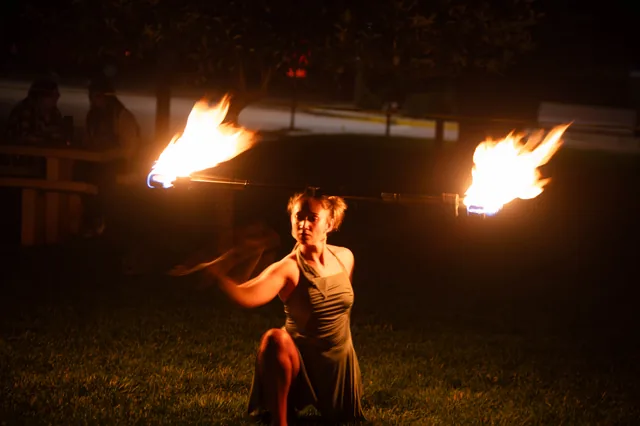 Fire staff and a dramatic kneeling pose
