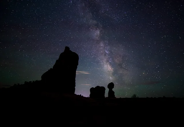 Milky Way and desert rock silhouettes