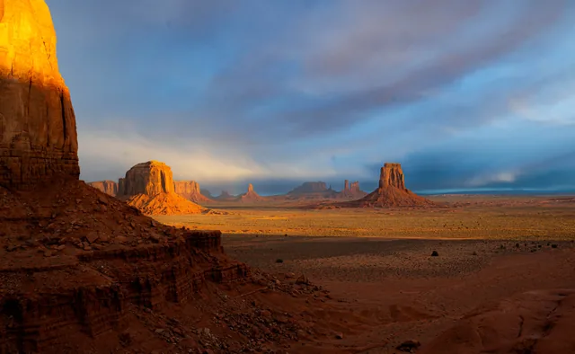 Monument Valley, framed in gold and shadow