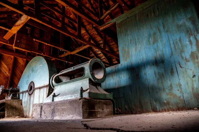 Old machinery, timber, and blue metal