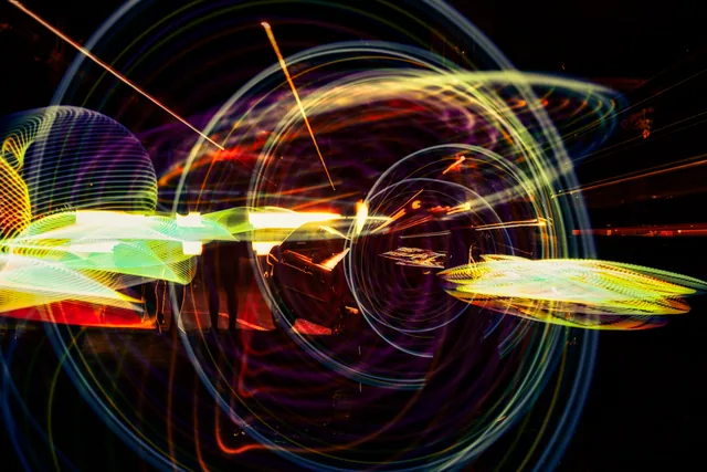Orbiting ribbons of colored light