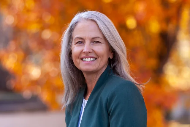 Portrait against glowing autumn leaves