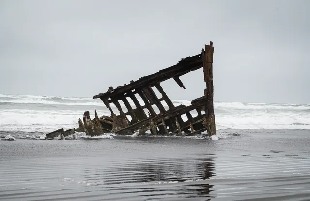 Shipwreck and reflection in the surf