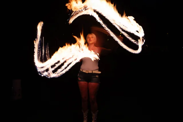 Sweeping arcs of fire against the dark