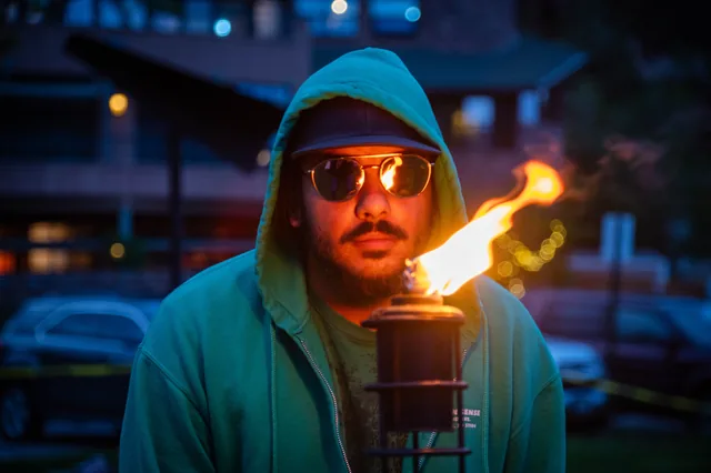 Torch-lit portrait in blue and orange