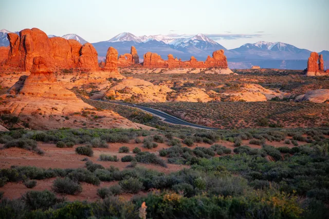 Warm sandstone and distant snow peaks